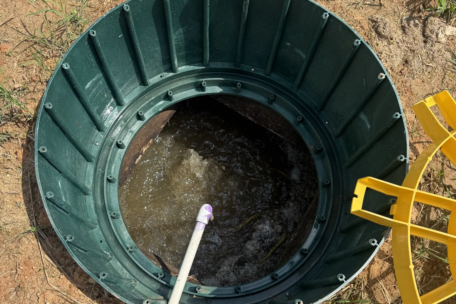 Aeration running inside a septic tank after the restoration unit was installed